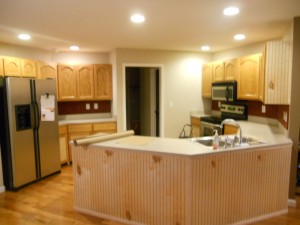 Antique white cabinets with brown glaze before photo